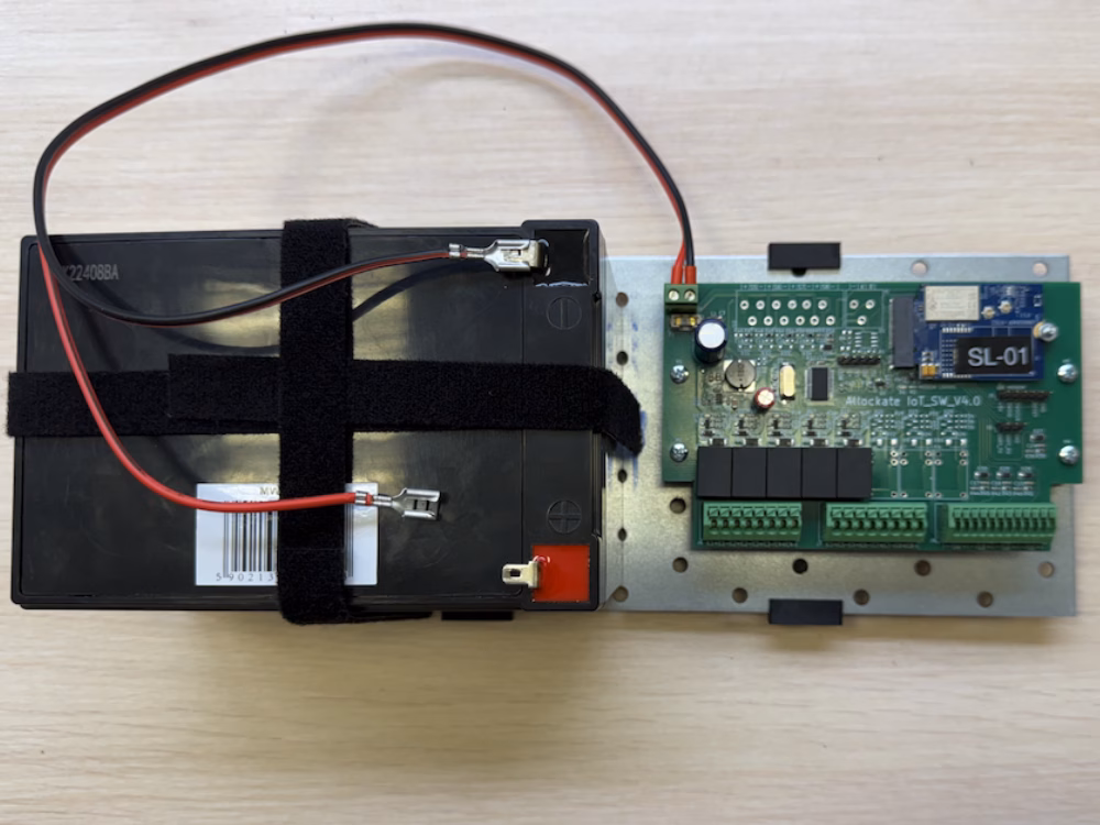 Battery and Allockate Access System Controller mounted on plate